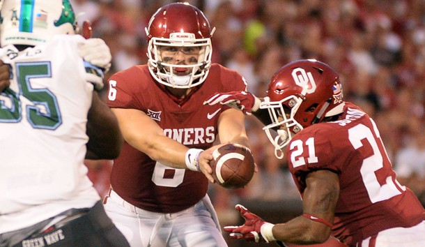 Sep 16, 2017; Norman, OK, USA; Oklahoma Sooners quarterback Baker Mayfield (6) hands off the ball to Oklahoma Sooners running back Marcelias Sutton (21) to score a touchdown against the Tulane Green Wave during the third quarter at Gaylord Family - Oklahoma Memorial Stadium. Photo Credit: Mark D. Smith-USA TODAY Sports