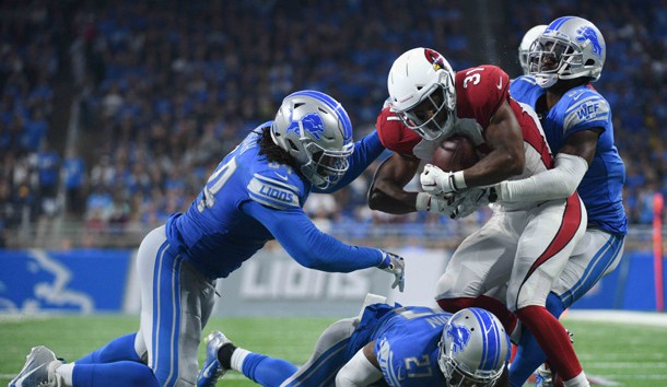Sep 10, 2017; Detroit, MI, USA; Arizona Cardinals running back David Johnson (31) is tackled by Detroit Lions defensive back D.J. Hayden (31) and free safety Glover Quin (27) and defensive end Ezekiel Ansah (94) during the third quarter at Ford Field. Photo Credit: Tim Fuller-USA TODAY Sports