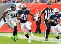 Titans overcome sputtering start, outslug Seahawks