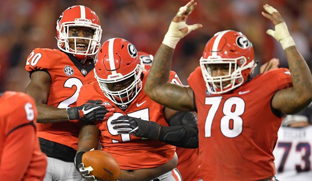 Sep 16, 2017; Athens, GA, USA; Georgia Bulldogs nose tackle John Atkins (97) reacts with defensive back J.R. Reed (20) and defensive tackle Trenton Thompson (78) after recovering a fumble against the Samford Bulldogs during the second half at Sanford Stadium. Photo Credit: Dale Zanine-USA TODAY Sports
