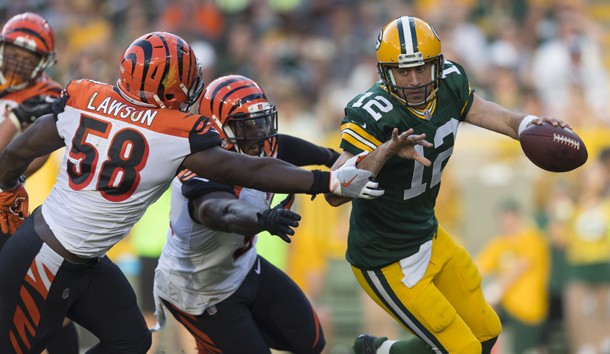 Sep 24, 2017; Green Bay, WI, USA; Green Bay Packers quarterback Aaron Rodgers (12) scrambles under pressure from Cincinnati Bengals linebacker Carl Lawson (58) during the third quarter at Lambeau Field. Photo Credit: Jeff Hanisch-USA TODAY Sports