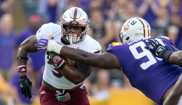 Sep 30, 2017; Baton Rouge, LA, USA; LSU Tigers nose tackle Greg Gilmore (99) tackles Troy Trojans running back Jordan Chunn (38) in the first quarter of the game between the LSU Tigers and the Troy Trojans at Tiger Stadium. Photo Credit: Stephen Lew-USA TODAY Sports