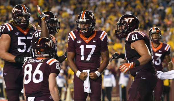 Sep 3, 2017; Landover, MD, USA; Virginia Tech Hokies quarterback Josh Jackson (17) celebrates with teammates after scoring a touchdown against the West Virginia Mountaineers during the second quarter at FedEx Field. Mandatory Credit: Derik Hamilton-USA TODAY Sports