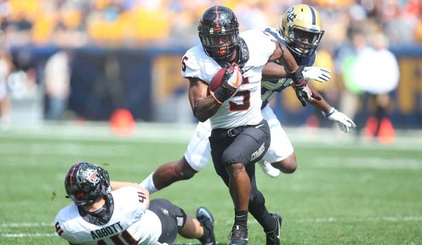 Sep 16, 2017; Pittsburgh, PA, USA;  Oklahoma State Cowboys running back Justice Hill (5) runs the ball against  the Pittsburgh Panthers during the first quarter at Heinz Field. The Cowboys won 59-21. Photo Credit: Charles LeClaire-USA TODAY Sports