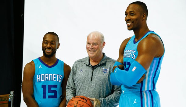 Sep 25, 2017; Charlotte, NC, USA; Charlotte Hornets guard Kemba Walker (15), head coach Steve Clifford and center Dwight Howard (12) pose for a picture during Media Day at Spectrum Center. Photo Credit: Jeremy Brevard-USA TODAY Sports