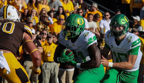 Sep 16, 2017; Laramie, WY, USA; Oregon Ducks running back Royce Freeman (21) scores a touchdown against the Wyoming Cowboys during the first quarter at War Memorial Stadium. Photo Credit: Troy Babbitt-USA TODAY Sports