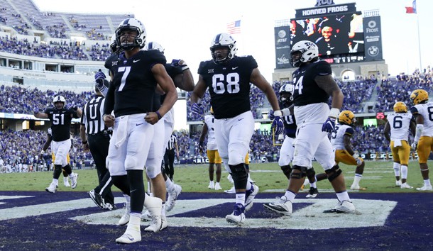 Oct 7, 2017; Fort Worth, TX, USA; TCU Horned Frogs quarterback Kenny Hill (7) celebrates with teammates after scoring the game-winning touchdown during the fourth quarter against the West Virginia Mountaineers at Amon G. Carter Stadium. Photo Credit: Kevin Jairaj-USA TODAY Sports