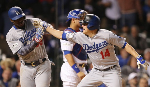 Oct 19, 2017; Chicago, IL, USA; Los Angeles Dodgers outfielder Enrique Hernandez (14) celebrates with right fielder Yasiel Puig (left) after hitting a two-run home run against the Chicago Cubs in the 9th inning in game five of the 2017 NLCS playoff baseball series at Wrigley Field. Photo Credit: Dennis Wierzbicki-USA TODAY Sports