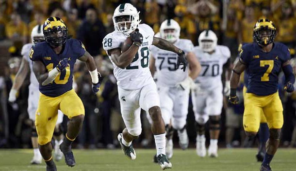 Oct 7, 2017; Ann Arbor, MI, USA; Michigan State Spartans running back Madre London (28) rushes in the first half against the Michigan Wolverines at Michigan Stadium. Photo Credit: Rick Osentoski-USA TODAY Sports