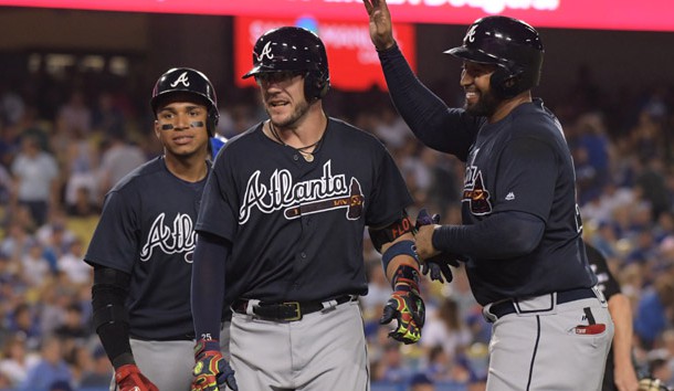 Jul 21, 2017; Los Angeles, CA, USA; Atlanta Braves catcher Tyler Flowers (middle) celebrates with left fielder Matt Kemp (right) and shortstop Johan Camargo after hitting a three-run home run in the sixth inning against the Los Angeles Dodgers at Dodger Stadium. Photo Credit: Kirby Lee-USA TODAY Sports