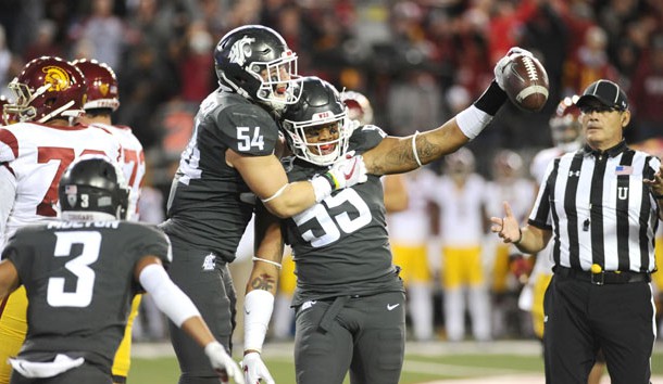 Sep 29, 2017; Pullman, WA, USA; Washington State Cougars linebacker Nate DeRider (54) and Washington State Cougars linebacker Derek Moore (55) celebrate a turnover against the USC Trojans during the second half at Martin Stadium. The Cougars won 30-27. Photo Credit: James Snook-USA TODAY Sports