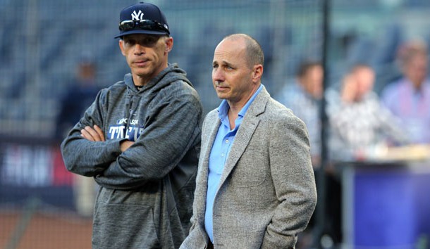Oct 3, 2017; Bronx, NY, USA; New York Yankees manager Joe Girardi (left) talks to general manager Brian Cashman during batting practice before the 2017 American League wildcard playoff baseball game against the Minnesota Twins at Yankee Stadium. Photo Credit: Brad Penner-USA TODAY Sports