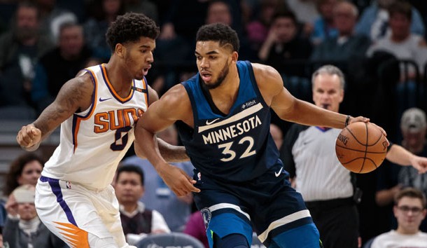 Nov 26, 2017; Minneapolis, MN, USA; Minnesota Timberwolves center Karl-Anthony Towns (32) dribbles in the third quarter against the Phoenix Suns forward Marquese Chriss (0) at Target Center. Photo Credit: Brad Rempel-USA TODAY Sports