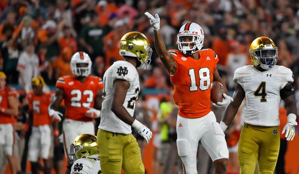 Nov 11, 2017; Miami Gardens, FL, USA; Miami Hurricanes wide receiver Lawrence Cager (18) signals for a first down after running the ball against the Notre Dame Fighting Irish during the first half at Hard Rock Stadium. Photo Credit: Jasen Vinlove-USA TODAY Sports