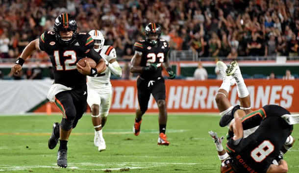 Nov 4, 2017; Miami Gardens, FL, USA; Miami Hurricanes quarterback Malik Rosier (12) carries the ball against the Virginia Tech Hokies during the first half at Hard Rock Stadium. Photo Credit: Steve Mitchell-USA TODAY Sports