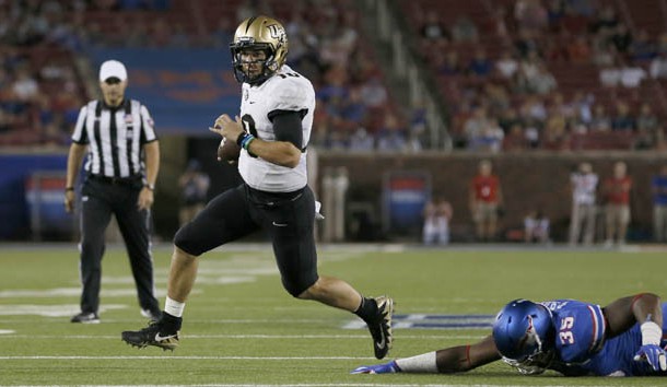 Nov 4, 2017; Dallas, TX, USA; UCF Knights quarterback McKenzie Milton (10) runs for a touchdown in the first quarter against the Southern Methodist Mustangs at Gerald J. Ford Stadium. Photo Credit: Tim Heitman-USA TODAY Sports