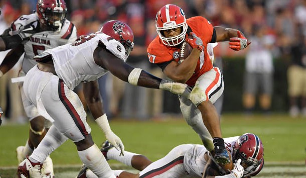 Nov 4, 2017; Athens, GA, USA; Georgia Bulldogs running back Nick Chubb (27) breaks a tackle by South Carolina Gamecocks defensive back D.J. Smith (24) during the second half at Sanford Stadium. Photo Credit: Dale Zanine-USA TODAY Sports