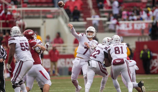 Nov 18, 2017; Fayetteville, AR, USA; Mississippi State Bulldogs quarterback Nick Fitzgerald (7) throws a pass for an eventual touchdown during the fourth quarter of the game against the Arkansas Razorbacks at Donald W. Reynolds Razorback Stadium. Mississippi State Bulldogs won 28-21. Photo Credit: Brett Rojo-USA TODAY Sports