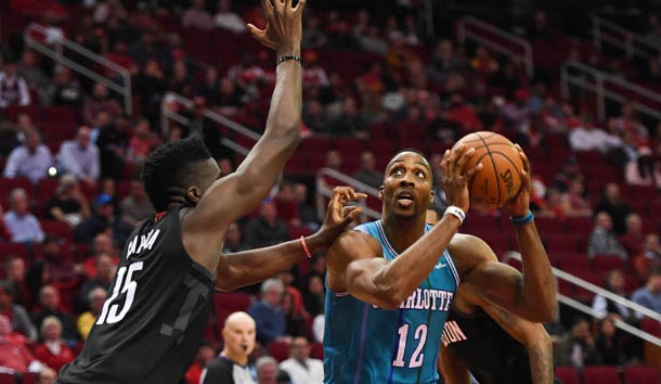 Dec 13, 2017; Houston, TX, USA; Charlotte Hornets center Dwight Howard (12) looks to shoot as Charlotte Hornets guard Kemba Walker (15) guards during the fourth quarter at Toyota Center. Photo Credit: Shanna Lockwood-USA TODAY Sports
