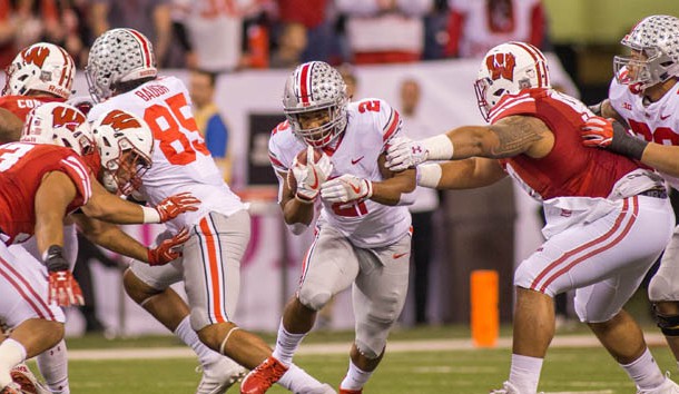 Dec 2, 2017; Indianapolis, IN, USA; Ohio State Buckeyes running back J.K. Dobbins (2) runs the ball while Wisconsin Badgers nose tackle Olive Sagapolu (99) tries to tackle him in the first half in the Big Ten championship game at Lucas Oil Stadium. Photo Credit: Trevor Ruszkowski-USA TODAY Sports