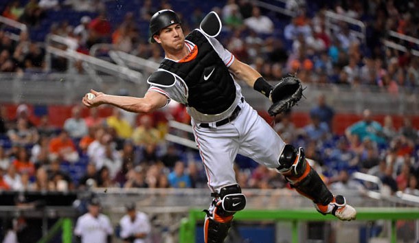 Sep 28, 2017; Miami, FL, USA; Miami Marlins catcher J.T. Realmuto (11) throws the ball to first base for an out in the third inning against the Atlanta Braves at Marlins Park. Photo Credit: Jasen Vinlove-USA TODAY Sports