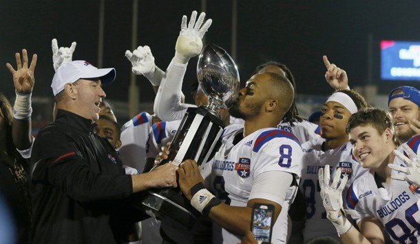 Dec 20, 2017; Frisco, TX, United States; Louisiana Tech Bulldogs quarterback J'Mar Smith (8) kisses the trophy after the game against the Southern Methodist Mustangs in the 2017 Frisco Bowl at Toyota Stadium. Photo Credit: Tim Heitman-USA TODAY Sports