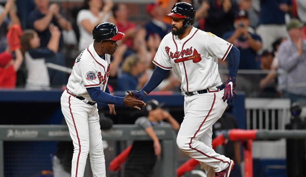 Sep 7, 2017; Atlanta, GA, USA; Atlanta Braves left fielder Matt Kemp (27) (right) shakes hands with third base coach Ron Washington (37) after hitting a home run against the Miami Marlins  during the fifth inning at SunTrust Park. Photo Credit: Dale Zanine-USA TODAY Sports