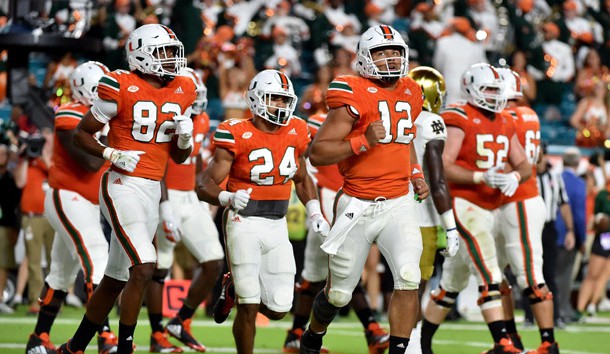 Nov 11, 2017; Miami Gardens, FL, USA; Miami Hurricanes quarterback Malik Rosier (12) runs in the end zone against Notre Dame Fighting Irish at Hard Rock Stadium. Photo Credit: Steve Mitchell-USA TODAY Sports