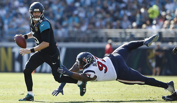 Dec 17, 2017; Jacksonville, FL, USA; Houston Texans defensive tackle Angelo Blackson (97) chases Jacksonville Jaguars quarterback Blake Bortles (5) out of the pocket during the first quarter at EverBank Field. Photo Credit: Reinhold Matay-USA TODAY Sports