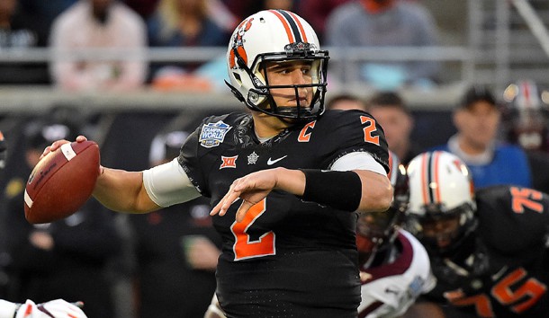 Dec 28, 2017; Orlando, FL, USA; Oklahoma State Cowboys quarterback Mason Rudolph (2) attempts a pass against the Virginia Tech Hokies during the first half in the 2017 Camping World Bowl at Camping World Stadium. Photo Credit: Jasen Vinlove-USA TODAY Sports