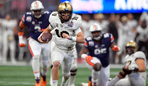 Jan 1, 2018; Atlanta, GA, USA; Central Florida Knights quarterback McKenzie Milton (10) runs for a touchdown against the Auburn Tigers during the first half at Mercedes-Benz Stadium. Photo Credit: Dale Zanine-USA TODAY Sports