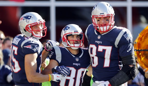 Oct 1, 2017; Foxborough, MA, USA; New England Patriots wide receiver Chris Hogan (15) and tight end Rob Gronkowski (87) celebrate with receiver Danny Amendola (80) after a touchdown during the second half against the Carolina Panthers at Gillette Stadium. Photo Credit: Greg M. Cooper-USA TODAY Sports