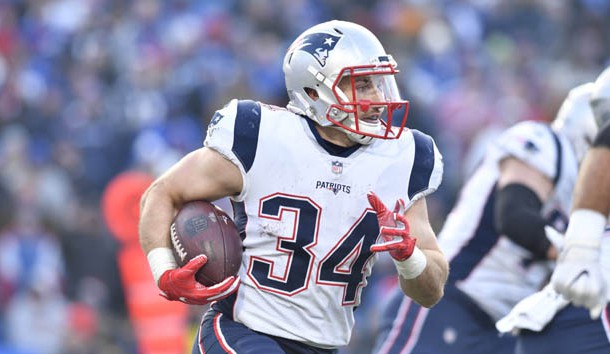 Dec 3, 2017; Orchard Park, NY, USA; New England Patriots running back Rex Burkhead (34) runs the ball wide during the fourth quarter against the Buffalo Bills at New Era Field.  Photo Credit: Mark Konezny-USA TODAY Sports
