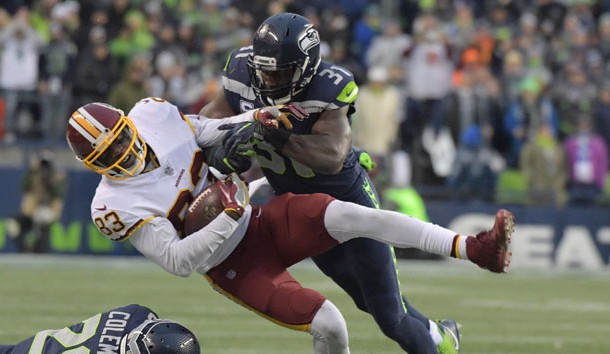 Nov 5, 2017; Seattle, WA, USA; Washington Redskins wide receiver Brian Quick (83) is tackled by Seattle Seahawks strong safety Kam Chancellor (31) in the fourth quarter during an NFL football game at CenturyLink Field. The Redskins defeated the Seahawks 17-14. Photo Credit: Kirby Lee-USA TODAY Sports