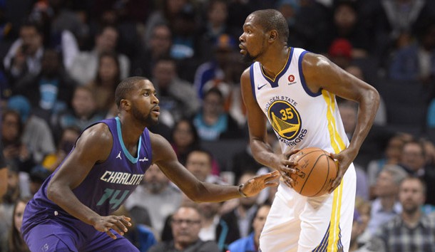 Dec 6, 2017; Charlotte, NC, USA; Golden State Warriors forward Kevin Durant (35) tries to pass against Charlotte Hornets forward Michael Kidd-Gilchrist (14) during the second half at the Spectrum Center. The Warriors won 101-87. Photo Credit: Sam Sharpe-USA TODAY Sports