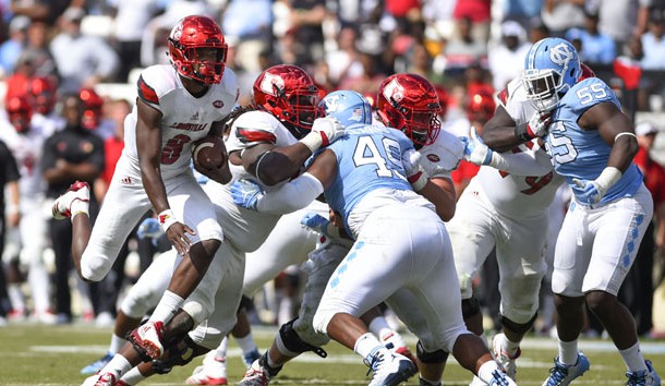 Sep 9, 2017; Chapel Hill, NC, USA; Louisville Cardinals quarterback Lamar Jackson (8) runs for a touchdown as North Carolina Tar Heels defensive tackle Jeremiah Clarke (49) and North Carolina Tar Heels defensive lineman Jason Strowbridge (55) defend in the fourth quarter. The Cardinals defeated the Tar Heels 47-35 at Kenan Memorial Stadium. Photo Credit: Bob Donnan-USA TODAY Sports