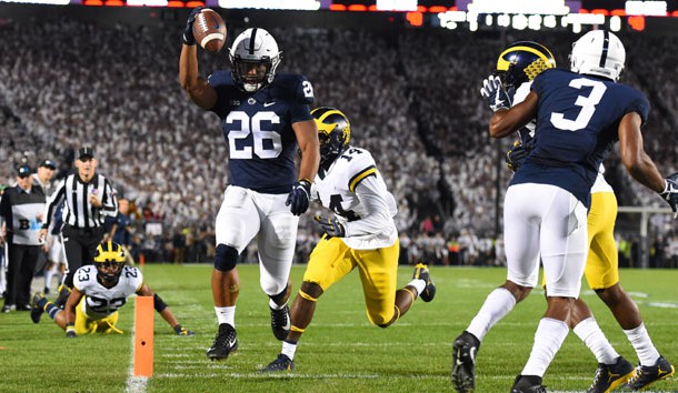 Oct 21, 2017; University Park, PA, USA; Penn State Nittany Lions running back Saquon Barkley (26) runs into the end zone for a touchdown against the Michigan Wolverines during the first quarter at Beaver Stadium. Photo Credit: Rich Barnes-USA TODAY Sports