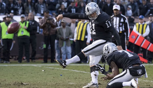 November 27, 2016; Oakland, CA, USA; Oakland Raiders kicker Sebastian Janikowski (11) kicks the game-winning field goal out of the hold by punter Marquette King (7) during the fourth quarter against the Carolina Panthers at Oakland Coliseum. The Raiders defeated the Panthers 35-32. Photo Credit: Kyle Terada-USA TODAY Sports