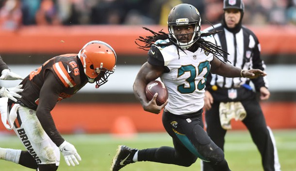 Nov 19, 2017; Cleveland, OH, USA; Jacksonville Jaguars running back Chris Ivory (33) runs with the ball as Cleveland Browns strong safety Derrick Kindred (26) comes in for the tackle during the second half at FirstEnergy Stadium. Photo Credit: Ken Blaze-USA TODAY Sports