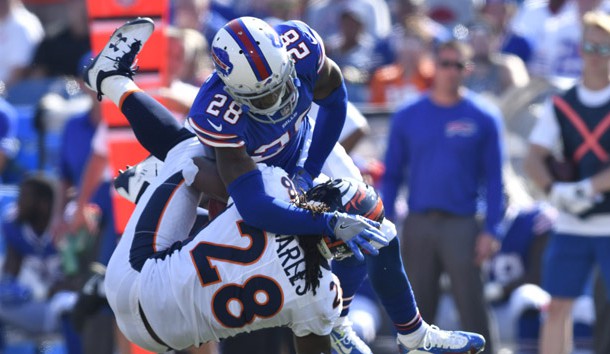 Sep 24, 2017; Orchard Park, NY, USA; Denver Broncos running back Jamaal Charles (28) is upended on a tackle by Buffalo Bills cornerback E.J. Gaines (28) during the third quarter of a game at New Era Field. Photo Credit: Mark Konezny-USA TODAY Sports