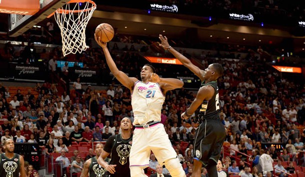 Feb 9, 2018; Miami, FL, USA; Miami Heat center Hassan Whiteside (21) drives to the basket past Milwaukee Bucks guard Tony Snell (21) during the second half an NBA game at the American Airlines Arena. The Heat won 91-85.  Photo Credit: Steve Mitchell-USA TODAY Sports
