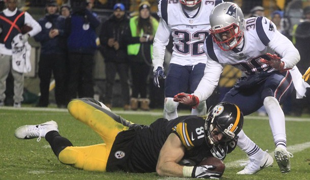 Dec 17, 2017; Pittsburgh, PA, USA; Pittsburgh Steelers tight end Jesse James (81) fails to hold the ball as he falls across the goal line against New England Patriots free safety Devin McCourty (32) and strong safety Duron Harmon (30) during the fourth quarter at Heinz Field. The play was ruled an incomplete pass. The Patriots won 27-24. Photo Credit: Charles LeClaire-USA TODAY Sports