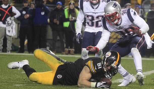 Dec 17, 2017; Pittsburgh, PA, USA;  Pittsburgh Steelers tight end Jesse James (81) fails to hold the ball as he falls across the goal line against New England Patriots free safety Devin McCourty (32) and strong safety Duron Harmon (30) during the fourth quarter at Heinz Field. The play was ruled an incomplete pass. The Patriots won 27-24. Photo Credit: Charles LeClaire-USA TODAY Sports