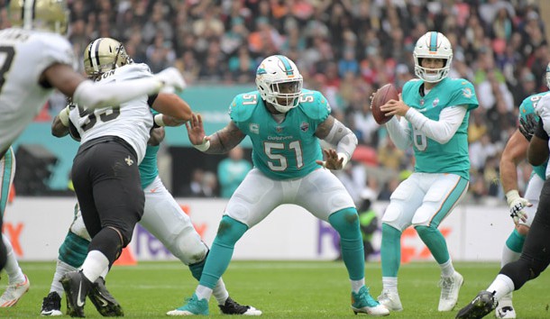 Oct 1, 2017; London, United Kingdom; Miami Dolphins center Mike Pouncey (51) defends as quarterback Jay Cutler (6) prepares to throw a pass against the New Orleans Saints during the NFL International Series game at Wembley Stadium. The Saints defeated the Dolphins 20-0. Photo Credit: Kirby Lee-USA TODAY Sports