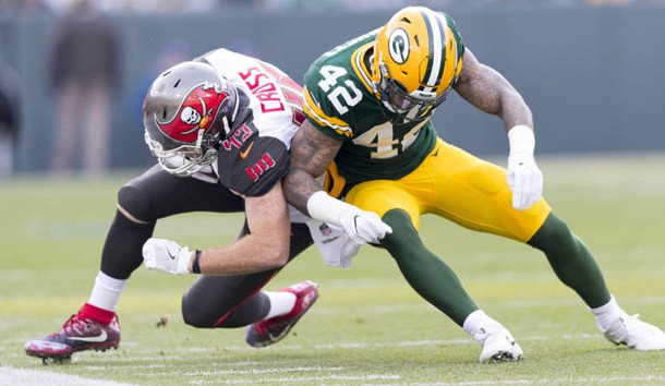 Dec 3, 2017; Green Bay, WI, USA; Tampa Bay Buccaneers tight end Alan Cross (45) is tackled by Green Bay Packers safety Morgan Burnett (42) during the first quarter at Lambeau Field. Photo Credit: Jeff Hanisch-USA TODAY Sports