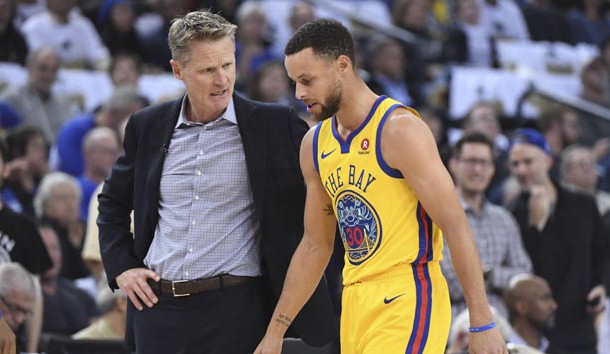 March 8, 2018; Oakland, CA, USA; Golden State Warriors head coach Steve Kerr (left) talks to guard Stephen Curry (30) after an injury against the San Antonio Spurs during the first quarter at Oracle Arena. Photo Credit: Kyle Terada-USA TODAY Sports