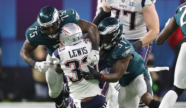 Former Eagles defensive end Vinny Curry (75) helps cornerback Jalen Mills (31) tackle New England Patriots running back Dion Lewis (33) in Super Bowl LII at U.S. Bank Stadium. Photo Credit: Matthew Emmons-USA TODAY Sports