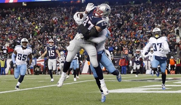 Jan 13, 2018; Foxborough, MA, USA; New England Patriots tight end Rob Gronkowski (87) makes a touchdown  catch against Tennessee Titans free safety Kevin Byard (31) during the fourth quarter in the AFC Divisional playoff game at Gillette Stadium. Mandatory Credit: Winslow Townson-USA TODAY Sports
