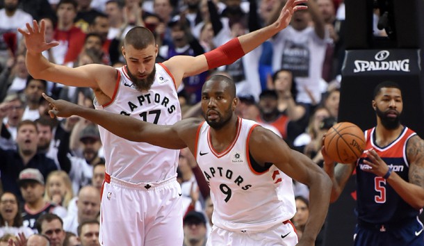 Apr 14, 2018; Toronto, Ontario, CAN;   Toronto Raptors forward Serge Ibaka (9) and center Jonas Valanciunas (17) react after scoring against Washington Wizards in game one of the first round of the 2018 NBA Playoffs at Air Canada Centre. Photo Credit: Dan Hamilton-USA TODAY Sports