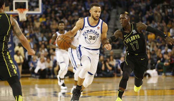 Mar 23, 2018; Oakland, CA, USA; Golden State Warriors guard Stephen Curry (30) dribbles past Atlanta Hawks guard Dennis Schroder (17) in the first quarter at Oracle Arena. Photo Credit: Cary Edmondson-USA TODAY Sports
